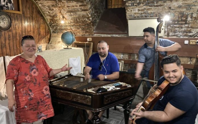 From left: Gyulane Farkas, Istvan Feher, Aron Feher and David Feher at Giero Pub, Budapest, May 16, 2022. (Yaakov Schwartz/Times of Israel)