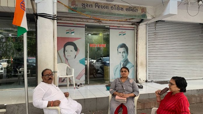Congress candidate for Surat West, Sanjay Patwa, outside the party office 